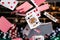 Red and Blue backed Playing cards cascading in front of a background of stacked poker chips