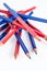 Red and blue bicolor pencils in a white background