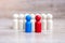 Red and blue businessmen with crowd of wooden men. Candidate, leadership, business, team, teamwork and Human resource management