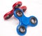 Red and blue fidget spinners