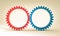 Red and blue gears on a neutral background