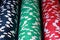 Red, blue, green, white and black poker chips columns