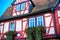 Red and blue half-timbered house in Buedingen, Germany