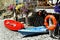 Red and blue kayaks with lifeline on sea beach