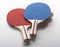 Red and Blue Ping Pong Paddles - Handles Facing Camera, Ball on