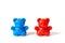 Red and blue plastic toy bears isolated on white background