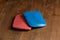 Red and Blue Tailor`s Chalk on Wooden Tabletop