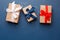 Red, blue and white gift boxes on classic blue background in the national colors of America, Russia, France or England, the