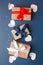 Red, blue and white gift boxes and white heart on classic blue background in the national colors of America, Russia, France or