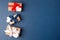 Red, blue and white gift boxes and white heart on classic blue background in the national colors of America, Russia, France or