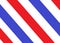 A red blue and white stripe wallpaper as in the detail of a barber shop signage or logo