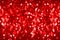 Red blurred shining bokeh background, defocused bright red sparkles backdrop, red shiny blur round bubbles, New Year, Christmas