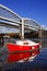 Red boat in the bay with railway bridge,Plymouth