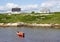 Red boat in harbour, houses, Peggy\'s Cove, Nova Scotia, Canada