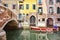 Red boat Venice scenic old streets water canal. Italian Lagoon