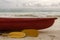 Red boat and yellow paddle