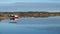 Red boathouse on Island from Storlauvoya on the Atlantic road in More og Romsdal in Norway