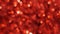 Red bokeh lights shimmering. Shiny Christmas blurred lights. Abstract particles background