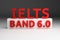 Red bold IELTS BAND 6.0 six point zero on white pedestal