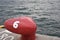 Red bollard number six in Osaka port