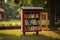 Red Bookcase With Books in Grass, Organized Reading Space Outdoors