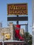 Red boot and neon sign for Allens Boots in Austin, Texas