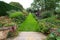 Red Border in the Arts and Crafts garden at Hidcote Manor in the English Cotswolds, designed by Lawrence Johnston.