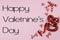 Red border of sparkly hearts and cute ribbon on a soft pink background for Valentine`s Day
