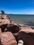 Red boulders on rocky shoreline of Lake Michigan