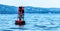 Red bouy marker in the ocean in Maine