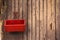 Red box hang on old wooden door