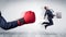 Red boxing glove knocks out little businessman