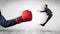 Red boxing glove knocks out little businessman