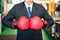 Red boxing gloves of factory businessman