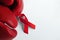 The red boxing gloves and ribbons isolated on white, symbolizing the fight against aids or hiv