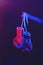 Red boxing gloves, ring with red and blue lights, industrial gym. selective focus