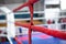 Red boxing ring ropes on blurred sports background