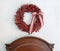 Red Boxwood Wreath above Wooden Headboard