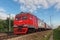 Red branded RZD Russian railways intercity electric train approaching