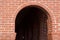 Red brick archway tunnel