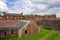 Red brick barracks in historical Fort George, Scotland with a ditch