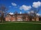 Red brick building, blue sky and tree