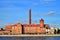 Red brick building with a tall chimney and business center Nevka on the Vyborg embankment