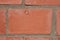 Red brick and cement texture as part of a wall frame close-up