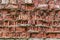 Red brick crumbled off wall wallpaper background backdrop