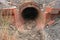Red brick culvert drain under road