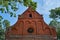 Red brick faÃ§ade of a 16th century church in Poland.