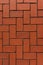 Red brick floor paving clinker brick in imperial format texture. Herringbone Brick clinker textures.