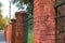 Red , brick gate pylons in row close up shot