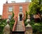 Red brick Georgian house with impressive steps.